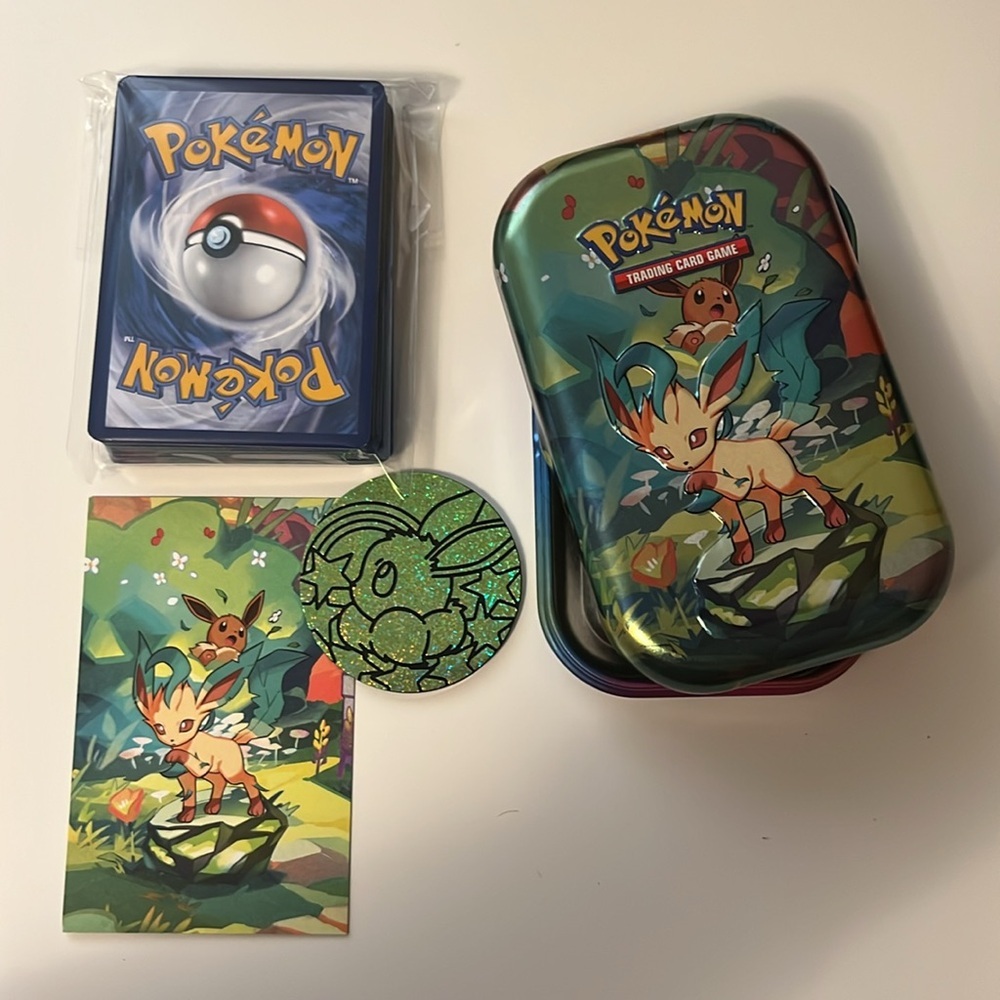 Pokemon Prismatic Evolution Tin Leafeon Design with 50 card bundle